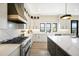 Bright kitchen featuring stainless steel appliances, quartz countertops and an island with bar seating at 912 Coronado Dr, Sedalia, CO 80135