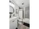 Modern bathroom with gray tiled shower and white fixtures offers a clean aesthetic at 1225 S Oneida St # 248, Denver, CO 80224