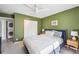 Bright bedroom with a ceiling fan, closet space and a stacked washer and dryer at 1225 S Oneida St # 248, Denver, CO 80224