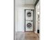 Convenient laundry area features a stacked washer and dryer in a closet at 1225 S Oneida St # 248, Denver, CO 80224