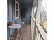 Private balcony with seating area and view of the grounds at 7505 W Yale St # 2103, Denver, CO 80227
