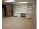 Finished basement with built-in shelving and cabinets at 7505 W Yale St # 2103, Denver, CO 80227