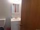 Basement bathroom with vanity and mirror at 7505 W Yale St # 2103, Denver, CO 80227