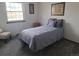 Bedroom with gray carpeting, a bed, and wall art at 7505 W Yale St # 2103, Denver, CO 80227