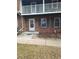 Brick condo building with a private entrance and small landscaping at 7505 W Yale St # 2103, Denver, CO 80227