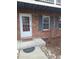 Brick condo building with a private entrance and small landscaping at 7505 W Yale St # 2103, Denver, CO 80227