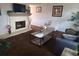 Bright living room features a fireplace and plenty of natural light at 7505 W Yale St # 2103, Denver, CO 80227