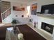 Spacious living room with a fireplace and ample natural light at 7505 W Yale St # 2103, Denver, CO 80227