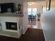 Living room with fireplace offers an open view to the dining area at 7505 W Yale St # 2103, Denver, CO 80227