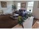 Living room with a loveseat, armchair, and coffee table at 7505 W Yale St # 2103, Denver, CO 80227