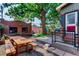 Large backyard with picnic table, landscaping, and shed at 1563 High St, Denver, CO 80218