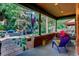 Relaxing front porch with colorful chairs and street view at 1563 High St, Denver, CO 80218