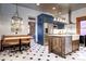 Modern kitchen with stainless steel appliances, a large island, and stylish blue cabinets at 1563 High St, Denver, CO 80218