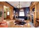 Living room features hardwood floors, fireplace, and large windows at 1563 High St, Denver, CO 80218