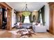 Bright living room with hardwood floors, large windows, and sectional sofa at 1563 High St, Denver, CO 80218
