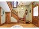 Ornate wooden staircase with detailed banister in a classic home at 1563 High St, Denver, CO 80218