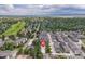 Aerial view pinpointing property location within a lush residential neighborhood with a golf course at 2366 S Troy St, Aurora, CO 80014