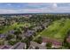 Breathtaking aerial view of the neighborhood showcasing the lush green landscape, golf course, and surrounding community at 2366 S Troy St, Aurora, CO 80014
