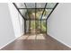 Sun-drenched atrium with expansive windows and wood floors at 2366 S Troy St, Aurora, CO 80014
