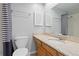 Well-lit bathroom featuring granite countertops and a striped shower curtain at 2366 S Troy St, Aurora, CO 80014