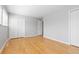 Light-filled bedroom with wood floors, ample closet space, and neutral walls, offering a blank canvas for personalization at 2366 S Troy St, Aurora, CO 80014