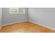 Bright bedroom with wood floors, ample space, and neutral walls, offering a calming atmosphere at 2366 S Troy St, Aurora, CO 80014