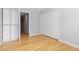Bright bedroom with natural light, featuring wood floors and an attached closet, creating a simple yet functional space at 2366 S Troy St, Aurora, CO 80014