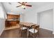Open dining and kitchen area with stainless appliances, wood cabinets and hardwood floor at 2366 S Troy St, Aurora, CO 80014