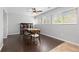 Cozy dining room with wood floors, natural light, and a stylish hutch at 2366 S Troy St, Aurora, CO 80014