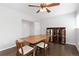 Inviting dining room with wood floors, stylish furniture, and ample natural light at 2366 S Troy St, Aurora, CO 80014