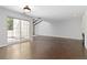 Open living room with wood floors, sliding glass door and fireplace at 2366 S Troy St, Aurora, CO 80014