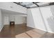 Open living room featuring wood floors, fireplace, and ample natural light at 2366 S Troy St, Aurora, CO 80014