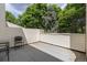 Secluded patio surrounded by lush greenery, perfect for outdoor entertaining at 2366 S Troy St, Aurora, CO 80014
