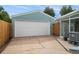 View of the detached two-car garage and fenced-in parking in the backyard at 1892 S Meade St, Denver, CO 80219