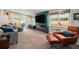 Modern living room featuring a linear fireplace, comfy seating, and lots of natural light at 1892 S Meade St, Denver, CO 80219