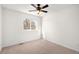 Cozy bedroom features neutral carpet and a ceiling fan with lighting at 16313 Roan Ct, Parker, CO 80134