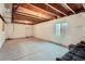 Unfinished basement with exposed ceiling and a small window at 10023 Uravan St, Commerce City, CO 80022