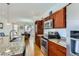 Granite counters, modern appliances and cabinetry highlight this open concept kitchen at 10023 Uravan St, Commerce City, CO 80022