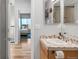 Bathroom vanity area with mosaic backsplash and modern fixtures at 3295 Blake St # 102, Denver, CO 80205