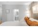 The main bedroom leads to a pristine bathroom with a sleek pedestal sink and neutral tones at 3295 Blake St # 102, Denver, CO 80205