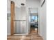 Hallway view into bedroom with wood floors and modern lighting at 3295 Blake St # 102, Denver, CO 80205