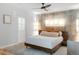 Stylish bedroom with hardwood floors, designer lighting, and a decorative accent wall at 3295 Blake St # 102, Denver, CO 80205