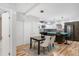 Open floor plan shows dining area adjacent to kitchen and breakfast bar at 3295 Blake St # 102, Denver, CO 80205