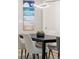 Dining area with contemporary pendant lighting and seating for four at 3295 Blake St # 102, Denver, CO 80205