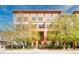 A vibrant apartment building with contemporary design and lush landscaping at 3295 Blake St # 102, Denver, CO 80205