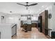 Modern kitchen featuring a large island with seating, stainless steel appliances, and hardwood floors at 3295 Blake St # 102, Denver, CO 80205