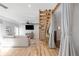 Spacious living area featuring a modern staircase, comfortable seating, and stylish decor for a welcoming ambiance at 3295 Blake St # 102, Denver, CO 80205