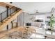 Inviting living area with a bright sofa, modern staircase, and stylish decor enhancing the open space at 3295 Blake St # 102, Denver, CO 80205