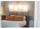 Close-up of the spacious main bedroom showcasing modern decor and a plush bed at 3295 Blake St # 102, Denver, CO 80205