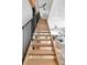 Beautiful staircase leading to the main living area with an open floorplan and modern design elements at 3295 Blake St # 102, Denver, CO 80205